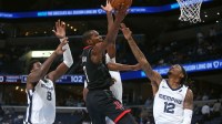 Rockets forward Kevin Durant (7) shoots as Memphis Grizzlies forward/center Jaren Jackson Jr. (8), forward Cedric Coward (23) and guard Ja Morant (12) defend during the fourth quarter at FedExForum