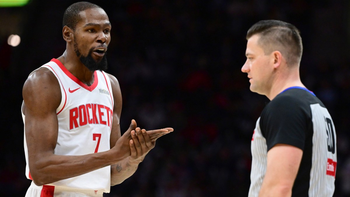 Rockets forward Kevin Durant (7) disputes a non call with referee Gediminas Petraitis (50) during the second half against the Cleveland Cavaliers at Rocket Arena with ESPN's Shams Charania