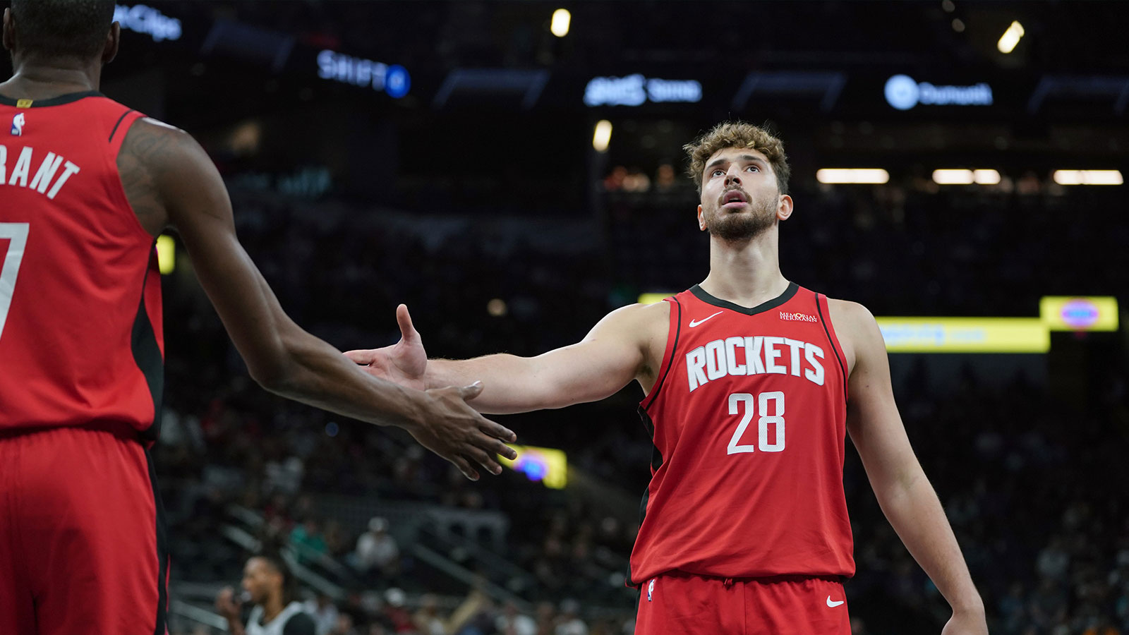 Rockets center Alperen Sengun (28) is congratulated by forward Kevin Durant (7) during the first quarter at Frost Bank Center