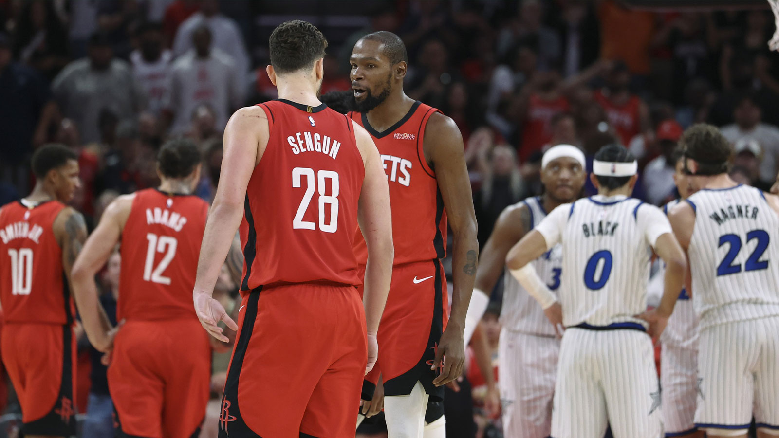 Rockets center Alperen Sengun (28) reacts with forward Kevin Durant (7) after making a basket during overtime against the Orlando Magic at Toyota Center