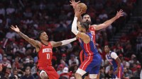 Houston Rockets forward Jabari Smith Jr. (10) and center Steven Adams (12) defend against Detroit Pistons guard Cade Cunningham (2) during the first quarter at Toyota Center.