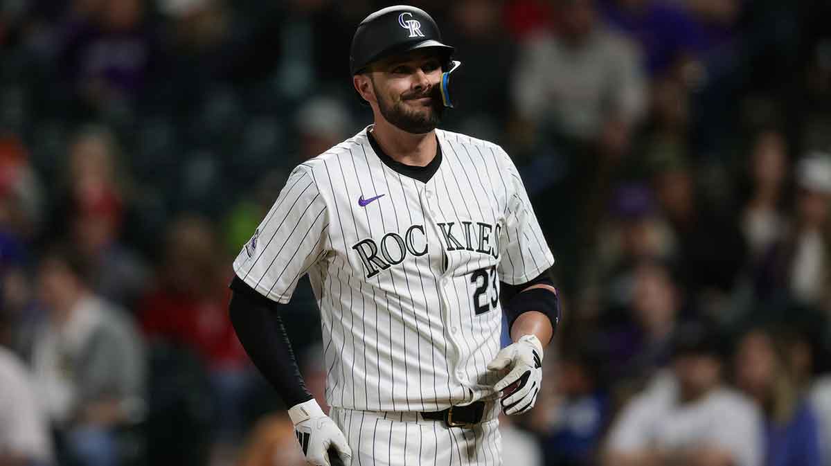 Colorado Rockies designated hitter Kris Bryant (23) reacts after a pitch in the tenth inning against the Philadelphia Phillies at Coors Field.