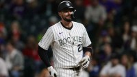 Colorado Rockies designated hitter Kris Bryant (23) reacts after a pitch in the tenth inning against the Philadelphia Phillies at Coors Field.