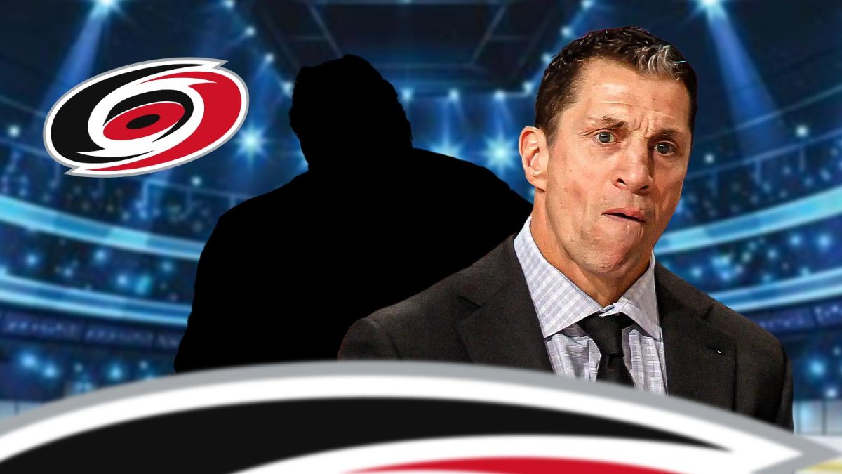 Rod Brind'Amour with a mystery player. Carolina Hurricanes logo background.
