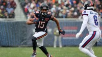 Chicago Bears wide receiver Rome Odunze (15) makes a catch against New York Giants safety Jevon Holland (8) during the first half at Soldier Field.