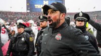 Ohio State head coach Ryan Day calls for the players and coaches to head back to the locker room after 27-9 win over Michigan at Michigan Stadium in Ann Arbor on Saturday, Nov. 29, 2025.