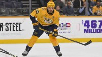 Nashville Predators center Ryan O'Reilly (90) skates with the puck against the Philadelphia Flyersduring the first period at Bridgestone Arena