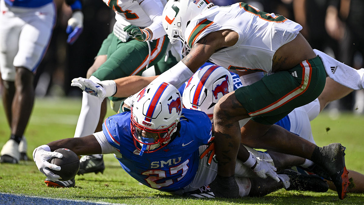 SMU Mustangs running back T.J. Harden (27) dives for the goal line during the overtime period against the Miami Hurricanes at Gerald J. Ford Stadium.