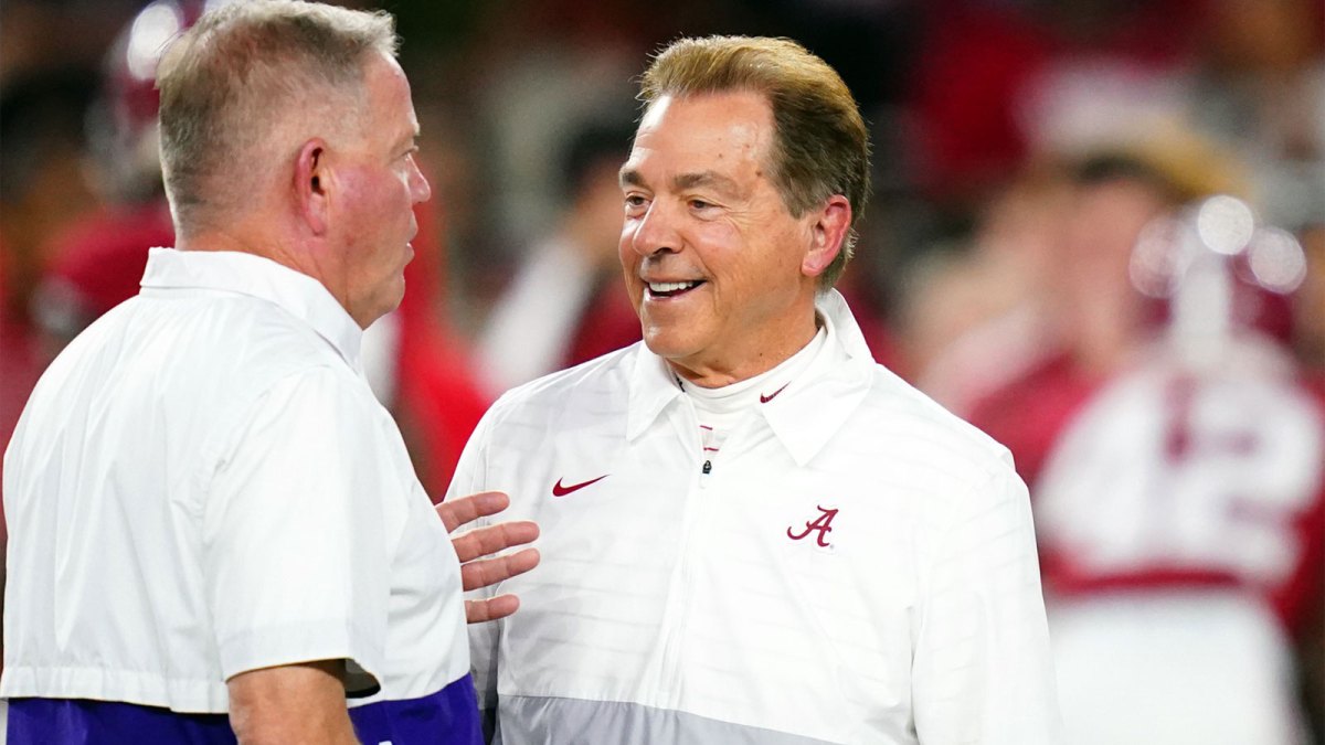 Alabama Crimson Tide head coach Nick Saban greets LSU Tigers head coach Brian Kelly midfield before their game at Bryant-Denny Stadium.