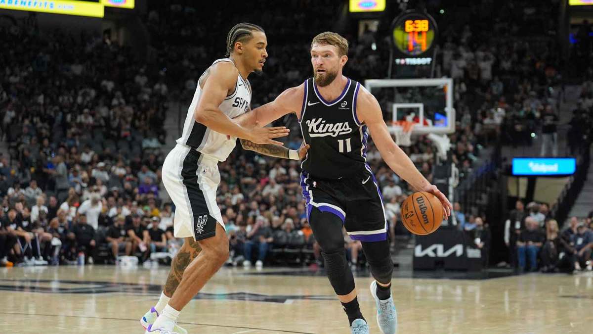 Sacramento Kings forward Domantas Sabonis (11) dribbles against San Antonio Spurs forward Jeremy Sochan (10) in the second half at Frost Bank Center.