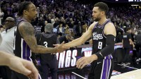 Sacramento Kings forward DeMar DeRozan (10) and guard Zach LaVine (8) celebrate at mid court after defeating the Minnesota Timberwolves at Golden 1 Center.