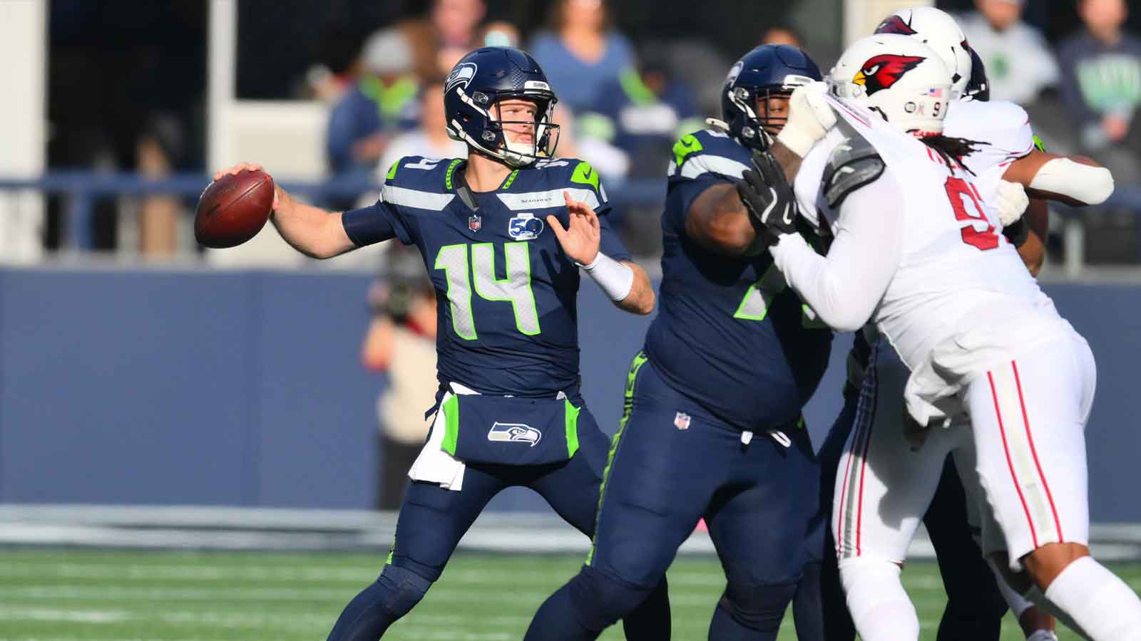 Seattle Seahawks quarterback Sam Darnold (14) throws a pass during the first quarter against the Arizona Cardinals at Lumen Field.