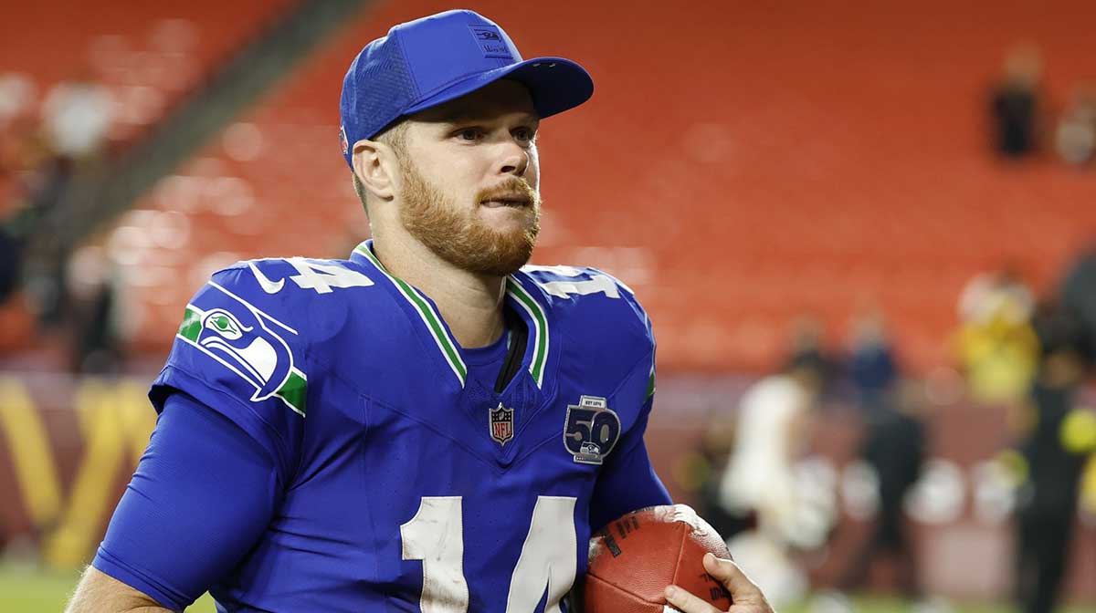 Seattle Seahawks quarterback Sam Darnold (14) leaves the field after the win against the Washington Commanders at Northwest Stadium.