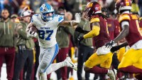 Detroit Lions tight end Sam LaPorta (87) makes a catch against Washington Commanders linebacker Frankie Luvu (4) during the first half at Northwest Stadium in Landover, Md. on Sunday, November 9, 2025.