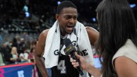 San Antonio Spurs guard De'Aaron Fox (4) gives an interview after the game against the Memphis Grizzlies at Frost Bank Center.