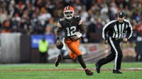 Cleveland Browns quarterback Shedeur Sanders (12) runs for a gain during the fourth quarter against the Baltimore Ravens at Huntington Bank Field.