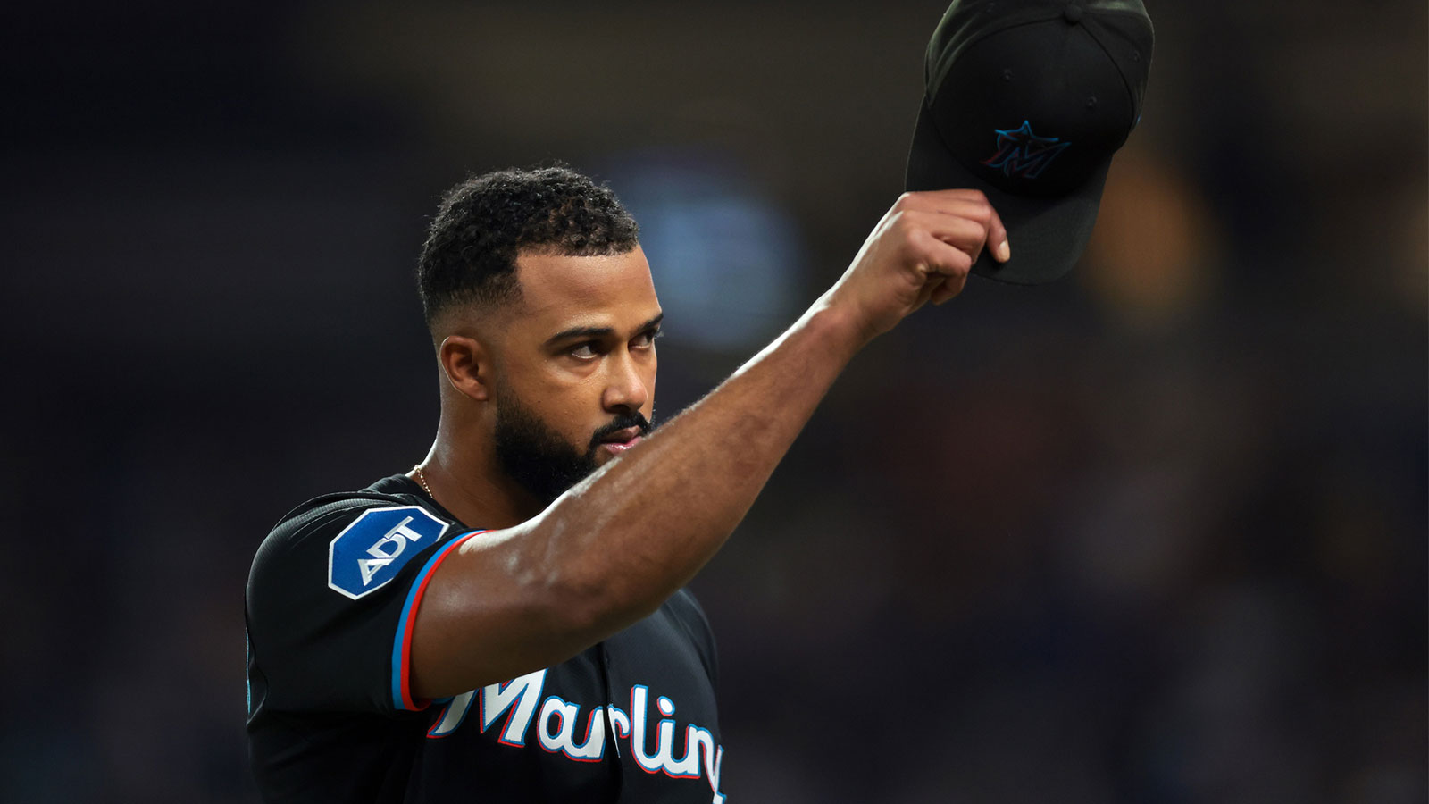Miami Marlins starting pitcher Sandy Alcantara (22) tips his hat off toward the fans as he exits the game against the New York Mets during the eighth inning at loanDepot Park. 