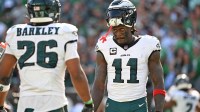 Philadelphia Eagles wide receiver AJ. Brown (11) and running back Saquon Barkley (26) during the fourth quarter against the Los Angeles Rams at Lincoln Financial Field.