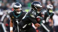Philadelphia Eagles quarterback Jalen Hurts (1) hands the ball to Philadelphia Eagles running back Saquon Barkley (26) against the Chicago Bears during the second quarter of the game at Lincoln Financial Field.