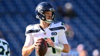 Seattle Seahawks quarterback Sam Darnold (14) warms up before a game against the Tennessee Titans at Nissan Stadium.