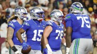 Seattle Seahawks wide receiver Tory Horton (15) celebrates a touchdown against the Washington Commanders during the first half at Northwest Stadium.