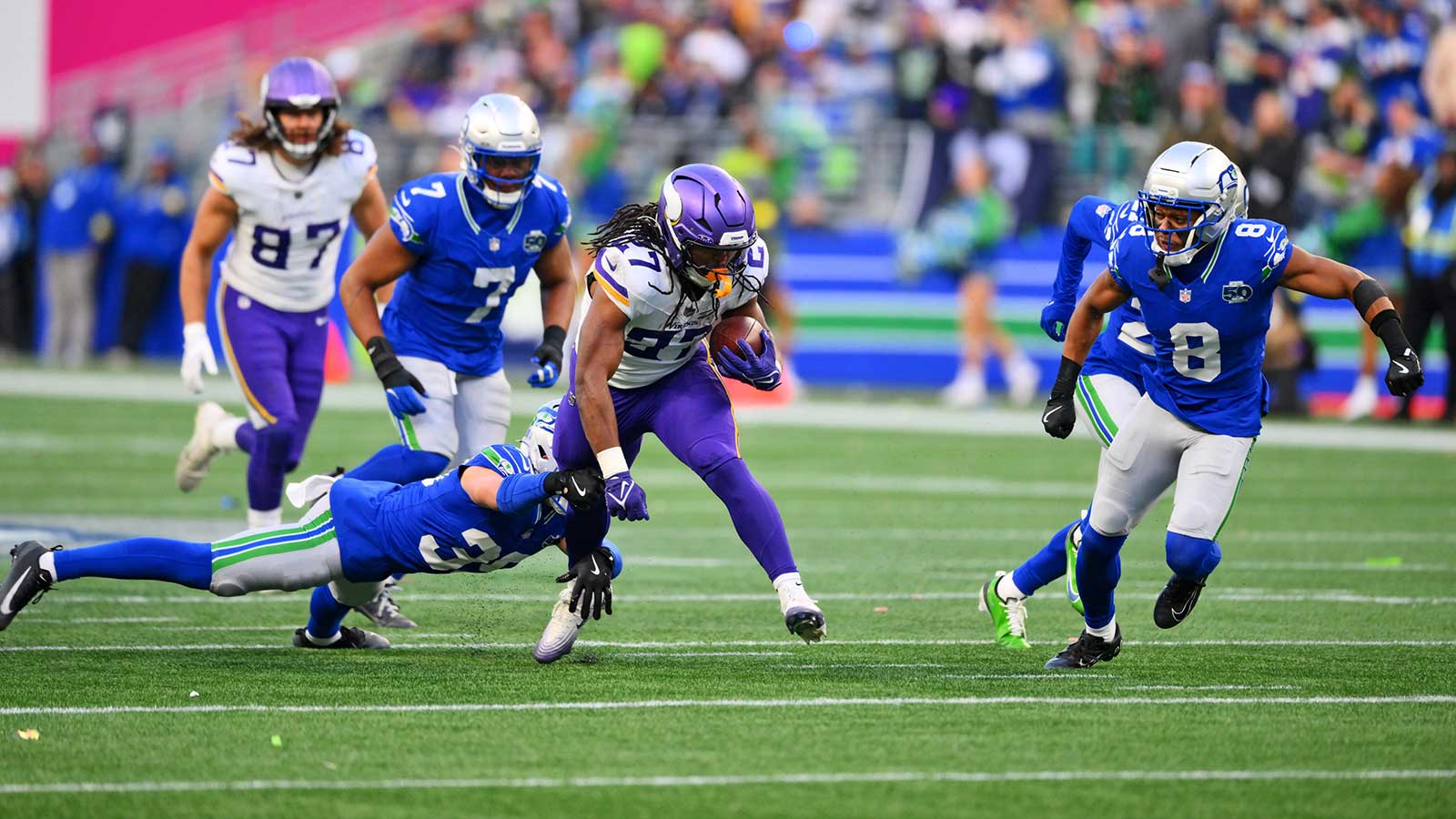Minnesota Vikings running back Jordan Mason (27) runs the ball during the second half against the Seattle Seahawks at Lumen Field.