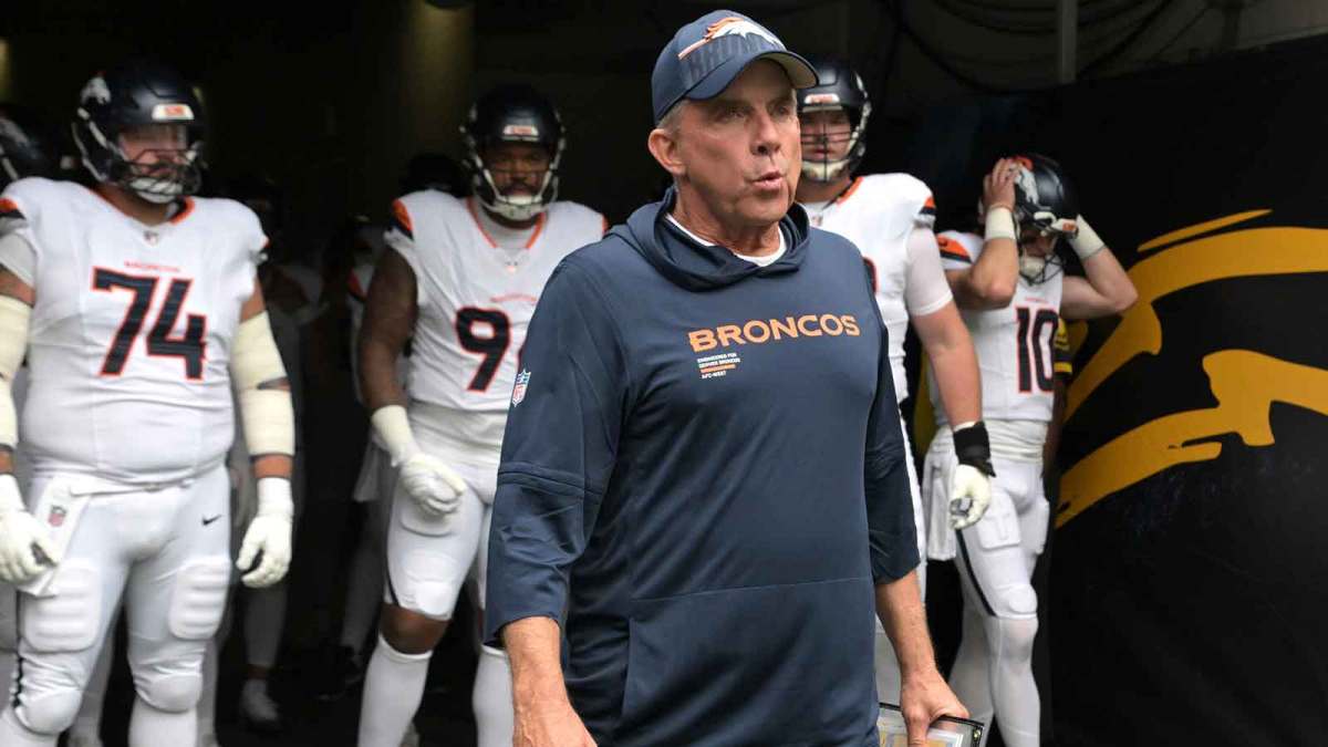 Denver Broncos head coach Sean Payton leads his film on to the field for the game against the Los Angeles Chargers at SoFi Stadium.