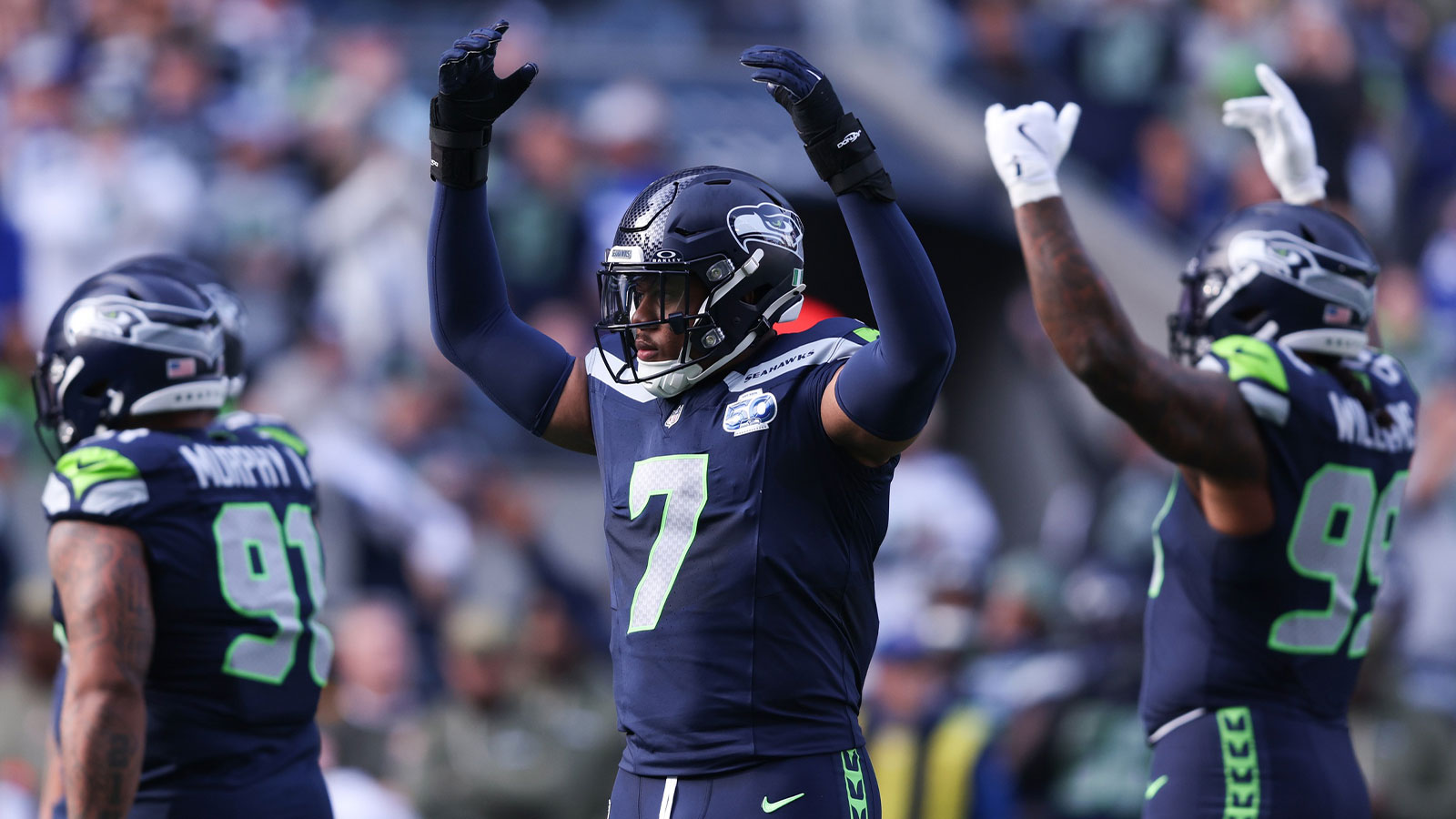 Nov 9, 2025; Seattle, Washington, USA; Seattle Seahawks linebacker Uchenna Nwosu (7) celebrates a defensive stop during the first quarter against the Arizona Cardinals at Lumen Field. Mandatory Credit: Kevin Ng-Imagn Images