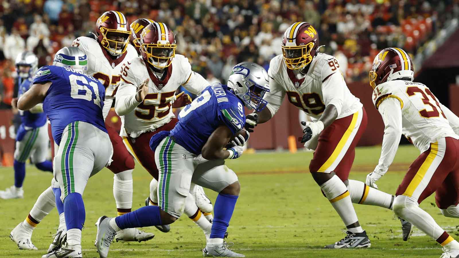 Seattle Seahawks running back Kenneth Walker III (9) runs with the ball against Washington Commanders