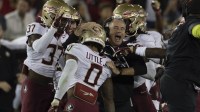 Florida State Seminoles head coach Mike Norvell celebrates with defensive back Earl Little Jr. (0) during the first quarter against the Stanford Cardinal at Stanford Stadium.