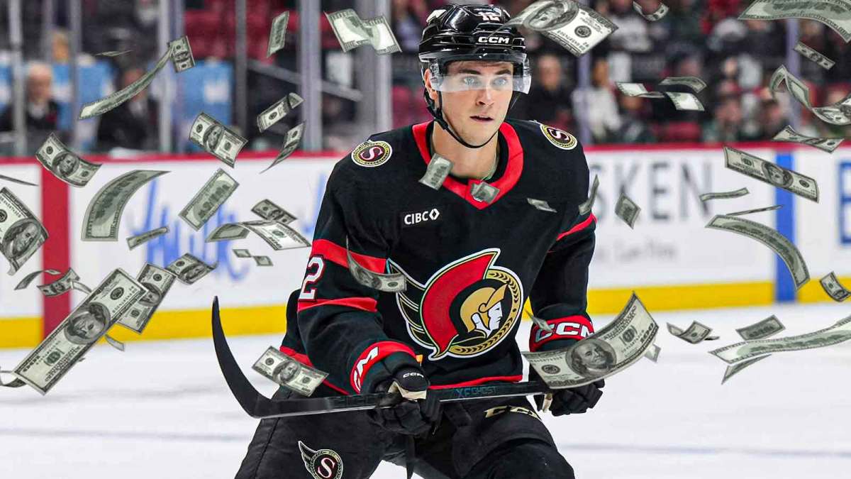 Ottawa Senators star Shane Pinto with money raining down around him.