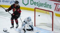 Utah Mammoth goalie Vitek Vanacek (41) blocks a shot that was screened by Ottawa Senators center Shane Pinto (12) in the third period at the Canadian Tire Centre.