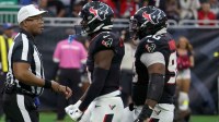 Houston Texans cornerback Kamari Lassiter (4) and defensive tackle Sheldon Rankins (90) celebrate after a play during the second half against the Denver Broncos at NRG Stadium.