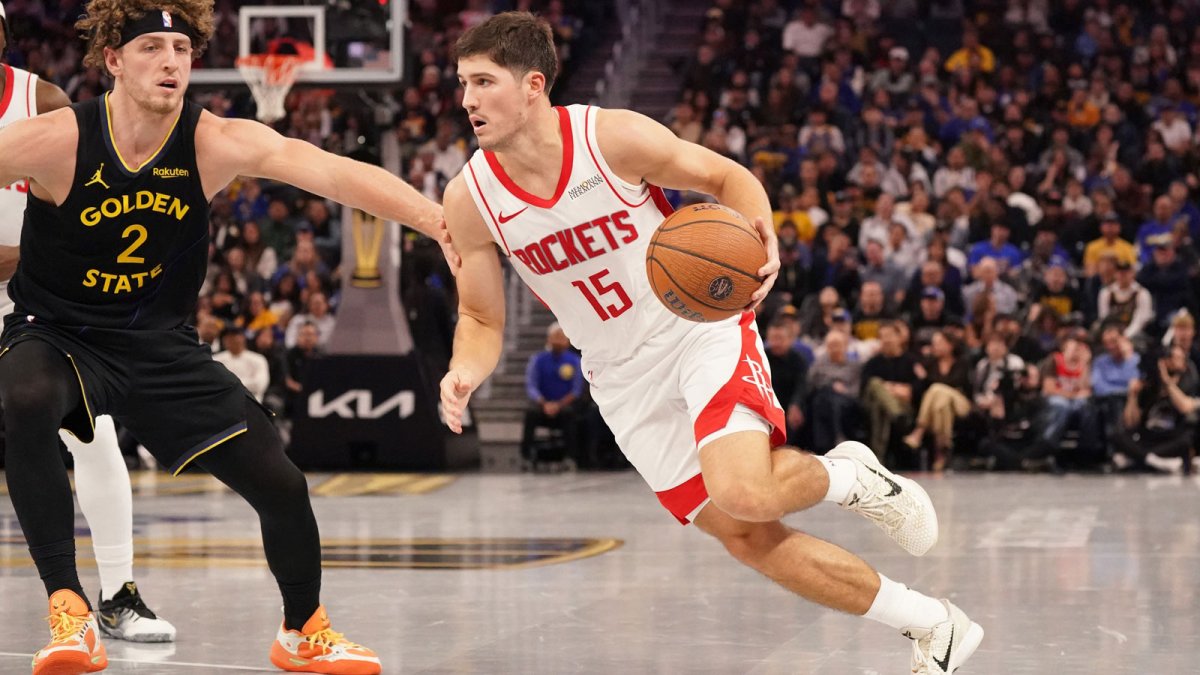 Houston Rockets guard Reed Sheppard (15) drives to the basket against Golden State Warriors guard Brandin Podziemski (2) in the third quarter at Chase Center.