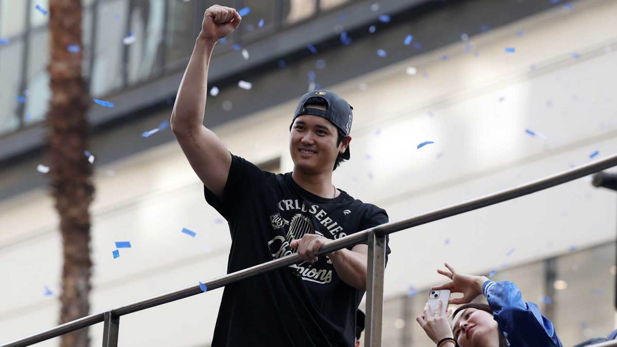 Los Angeles Dodgers two-way player Shohei Ohtani acknowledges the crowd during the World Series championship parade at downtown Los Angeles.