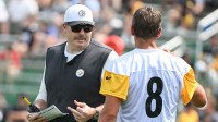 Pittsburgh Steelers offensive coordinator Arthur Smith talks with quarterback Aaron Rodgers (8) during drills at training camp at Saint Vincent College.
