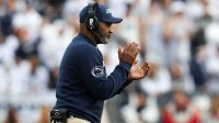 Penn State Nittany Lions head coach Terry Smith celebrates from the sideline during the third quarter against the Indiana Hoosiers at Beaver Stadium.