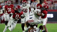 Oklahoma Sooners wide receiver Javonnie Gibson (11) is tackled by Alabama Crimson Tide wide receiver Germie Bernard (5) during the fourth quarter at Saban Field at Bryant-Denny Stadium.