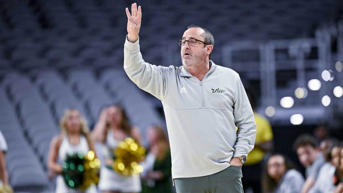 South Florida Bulls head coach Jose Fernandez motions to his team during the first half of the American Athletic Conference women's basketball tournament semifinals against the Houston Cougars at Dickies Arena.