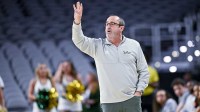 South Florida Bulls head coach Jose Fernandez motions to his team during the first half of the American Athletic Conference women's basketball tournament semifinals against the Houston Cougars at Dickies Arena.