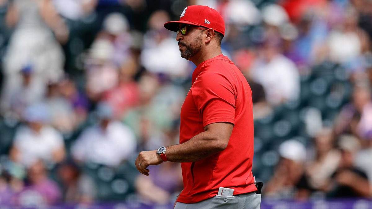 St. Louis Cardinals manager Oliver Marmol (37) walks to the mound in the seventh inning against the Colorado Rockies at Coors Field.