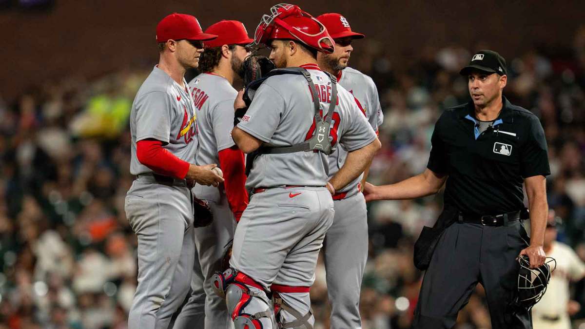 St. Louis Cardinals pitching coach Dusty Blake (90) comes out to discuss strategies with St. Louis Cardinals starting pitcher Sonny Gray (54) against the San Francisco Giants during the second inning at Oracle Park.