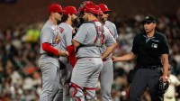 St. Louis Cardinals pitching coach Dusty Blake (90) comes out to discuss strategies with St. Louis Cardinals starting pitcher Sonny Gray (54) against the San Francisco Giants during the second inning at Oracle Park.