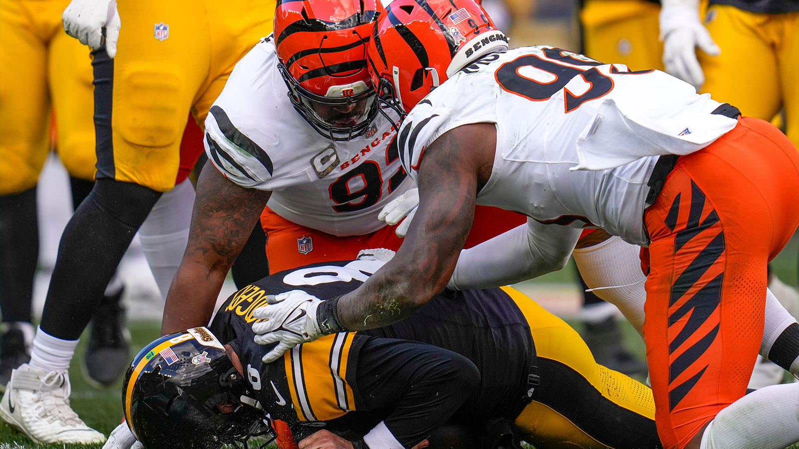 Cincinnati Bengals defensive tackle B.J. Hill (92) and defensive end Myles Murphy (99) sack Pittsburgh Steelers quarterback Aaron Rodgers (8) in the second quarter of the NFL Week 11 game between the Pittsburgh Steelers and the Cincinnati Bengals at Acrisure Stadium in Pittsburgh on Sunday, Nov. 16, 2025. The Steelers led 10-6 at halftime.