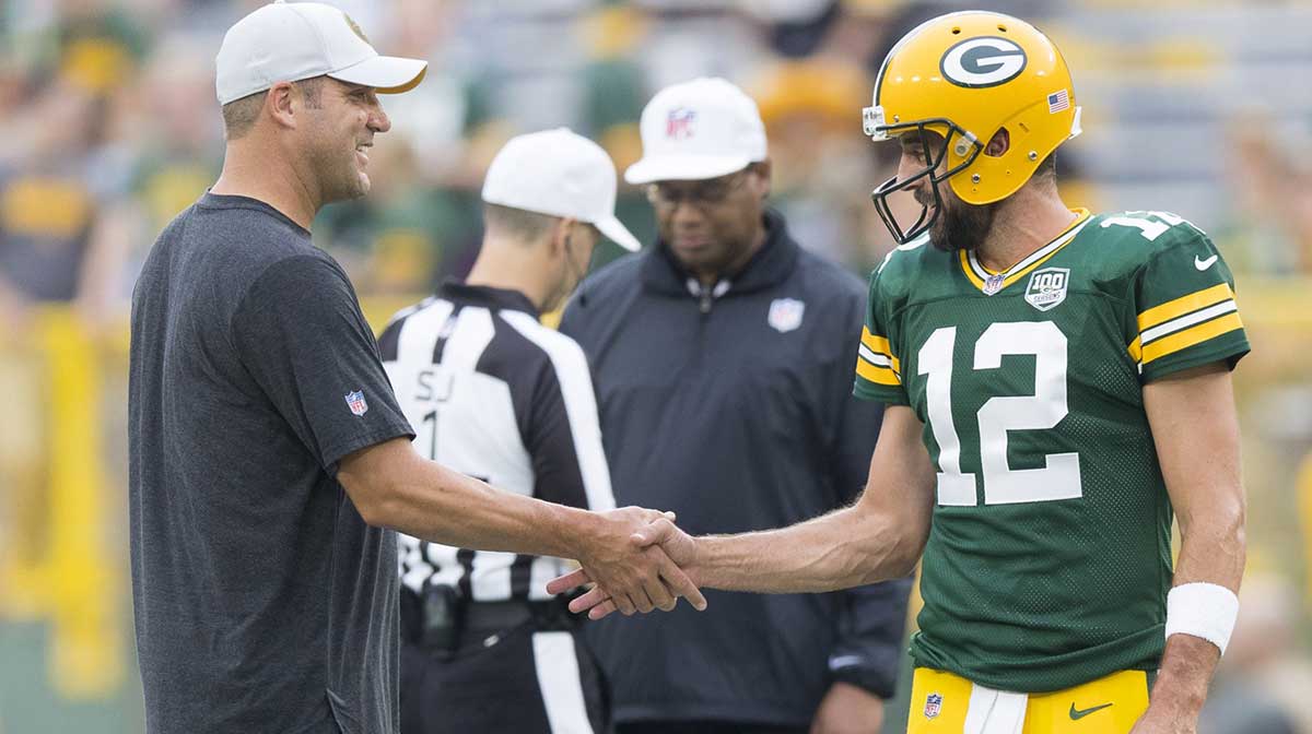 Pittsburgh Steelers quarterback Ben Roethlisberger greets Green Bay Packers quarterback Aaron Rodgers (12) during warmups prior to the game at Lambeau Field.