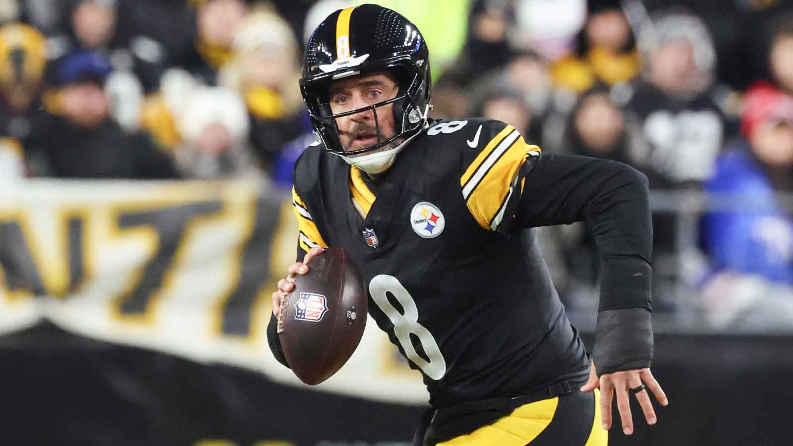 Steelers quarterback Aaron Rodgers (8) looks to pass