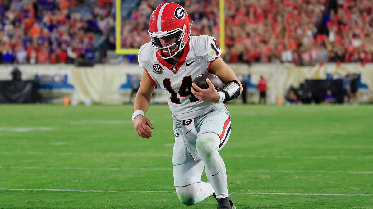Georgia Bulldogs quarterback Gunner Stockton (14) kneels before the goal line to pick up the first down and run out the clock during the fourth quarter of an NCAA football game, Saturday, Nov. 1, 2025, at EverBank Stadium in Jacksonville, Fla. Georgia held off Florida 24-20.