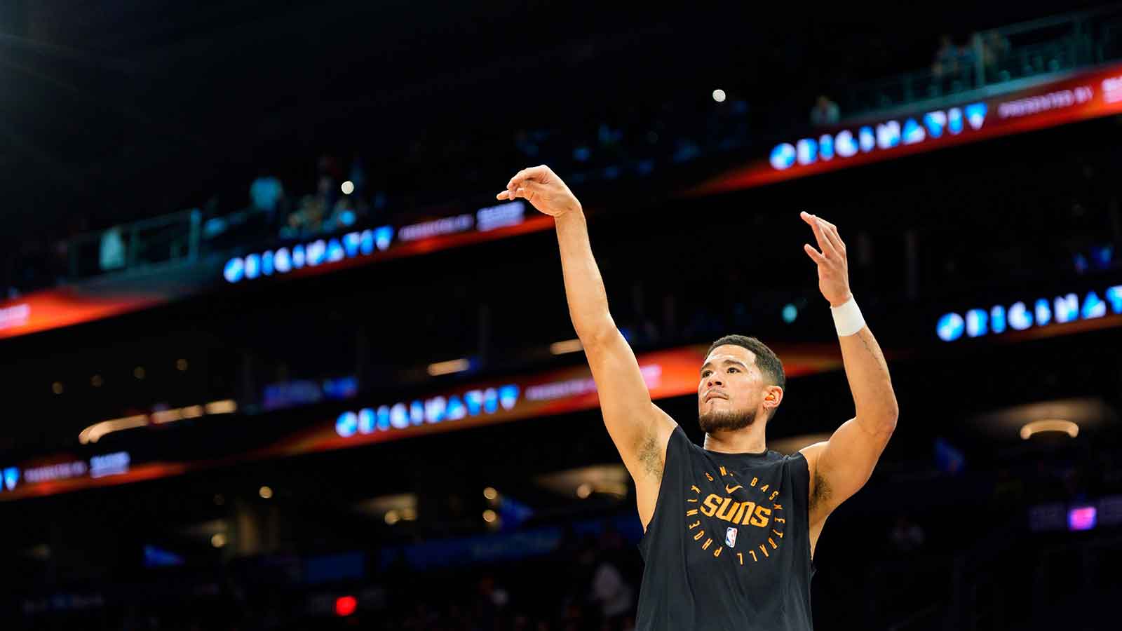 Suns guard Devin Booker (1) warms up for a game against the Atlanta Hawks at Mortgage Matchup Center