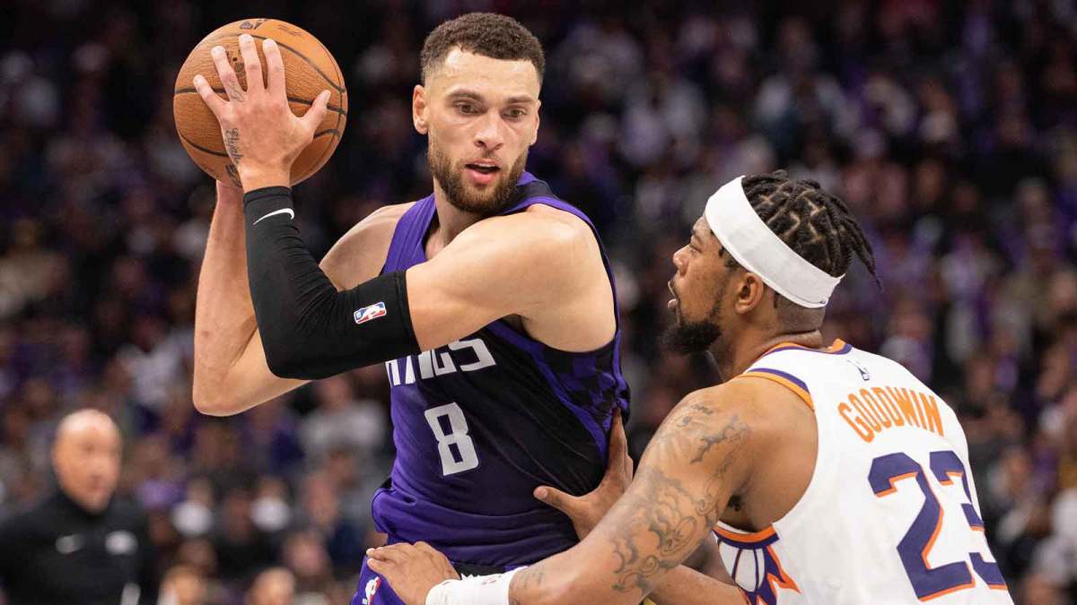 Sacramento Kings guard Zach Lavine (8) controls the ball against Phoenix Suns guard Jordan Goodwin (23) during the fourth quarter at Golden 1 Center.