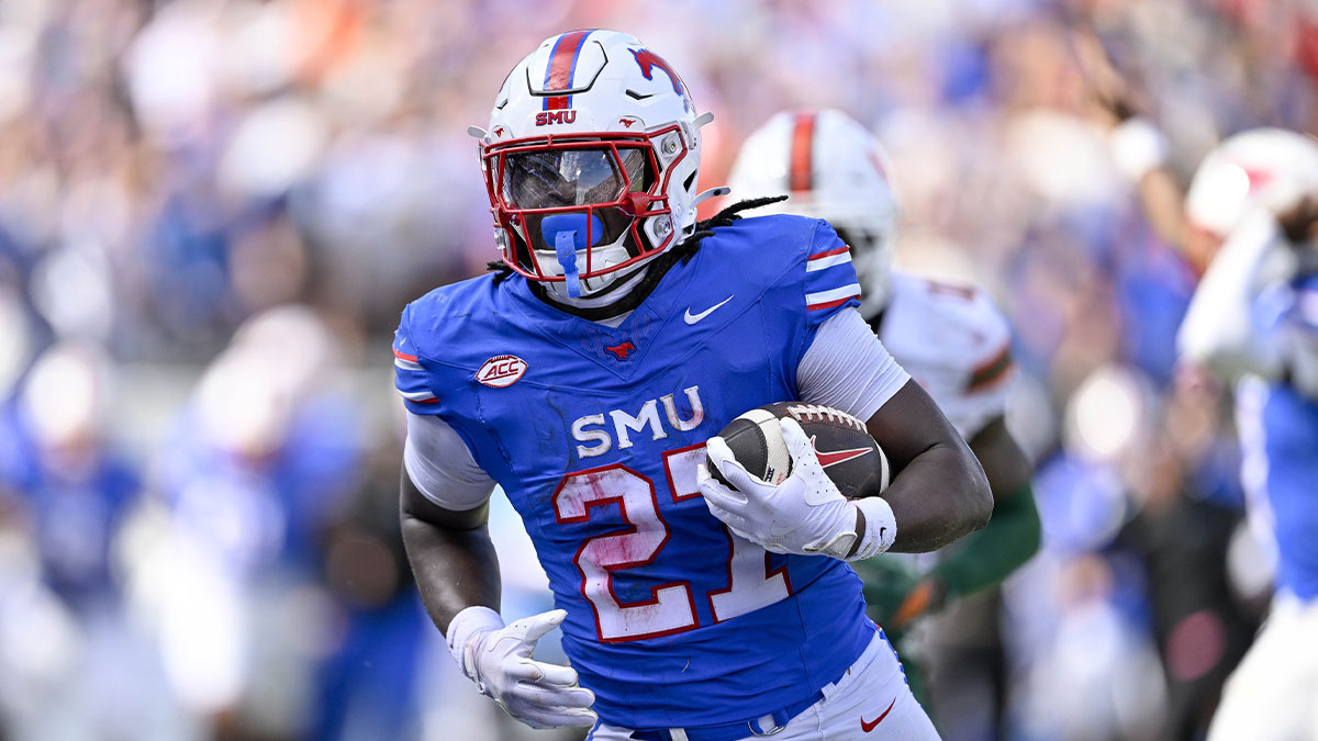 SMU Mustangs running back T.J. Harden (27) scores the game winning touchdown during the overtime period against the Miami Hurricanes at Gerald J. Ford Stadium.
